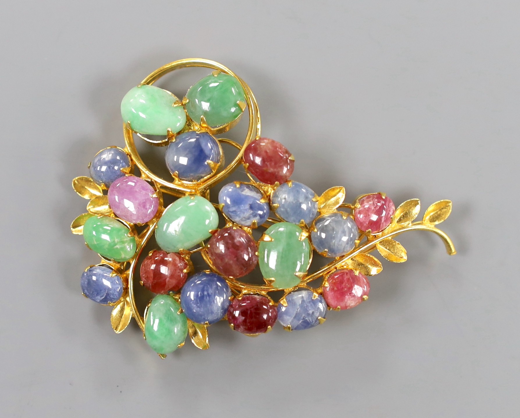 A gilt metal and multi cabochon stone set foliate spray brooch, 7cm.